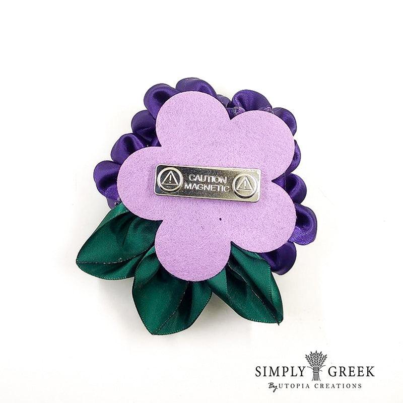 Purple violet flower cluster corsage.  Appropriate to wear as the Delta Sigma Theta purple violet.