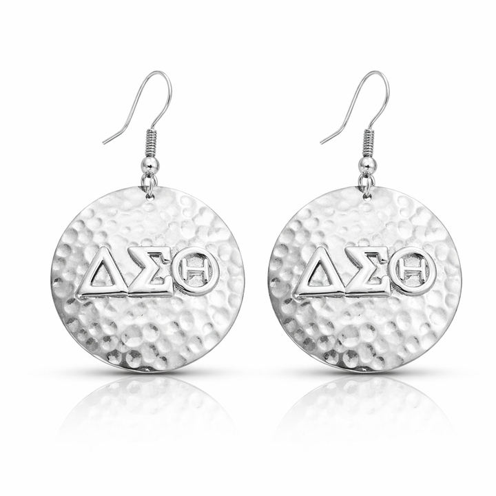 Silver hammered disc earrings with 'Delta Sigma Theta' Greek symbol on a white background