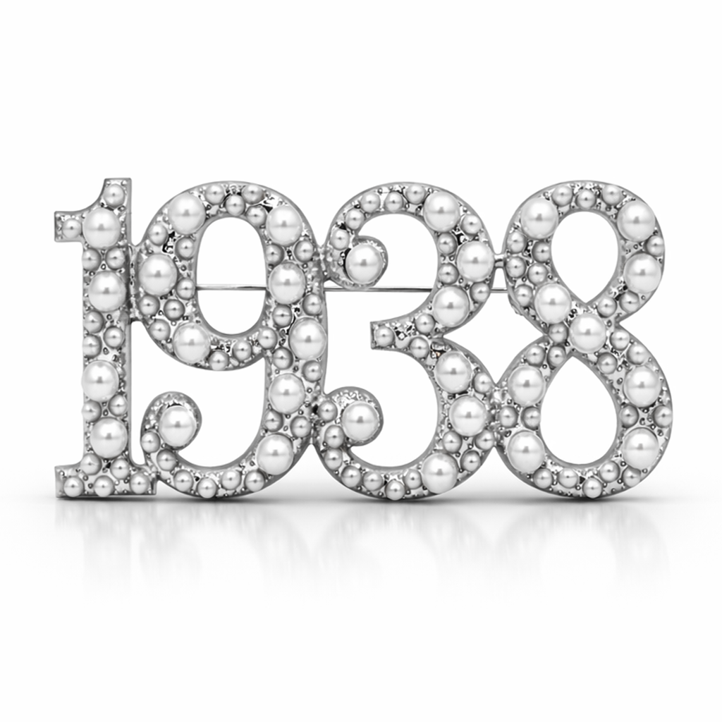 Brooch with '1938' made of pearls on a white background